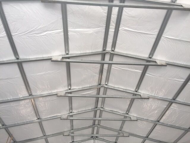 Framing of a commercial metal garage, insulation, roof.